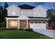 Beautiful two-story home with brick and white siding, a two-car garage, and well-maintained landscaping at 426 Bent Burr Crk, York, SC 29745