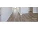 Hallway featuring neutral paint, light-colored plank flooring, and bright, natural light at 426 Bent Burr Crk, York, SC 29745