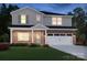 Charming two-story home featuring brick accents, a two-car garage, and a well-manicured lawn at 431 Bent Burr Crk, York, SC 29745