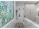 Elegant bathroom featuring an ornate stained glass window and shower at 4429 Cameron Oaks Dr, Charlotte, NC 28211