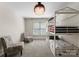 Cozy bedroom with a bunk bed and plush chairs beneath a chandelier at 4429 Cameron Oaks Dr, Charlotte, NC 28211