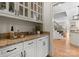 Elegant butler's pantry features granite counters, custom cabinets, and convenient access to the kitchen at 4429 Cameron Oaks Dr, Charlotte, NC 28211