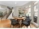 Bright dining area featuring hardwood floors, large windows, and comfortable seating for Gathering meals and entertaining at 4429 Cameron Oaks Dr, Charlotte, NC 28211