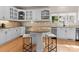 Eat-in kitchen with stainless steel appliances, granite countertops, custom cabinets, and modern bar stool seating at 4429 Cameron Oaks Dr, Charlotte, NC 28211