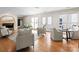 Sunlit living area boasts a fireplace, hardwood floors and balcony access at 4429 Cameron Oaks Dr, Charlotte, NC 28211