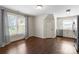 Bright, open living space with hardwood floors, large windows, and a modern kitchenette at 4429 Cameron Oaks Dr, Charlotte, NC 28211