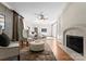 Spacious living room with a fireplace, seating, and access to the bedroom at 4429 Cameron Oaks Dr, Charlotte, NC 28211