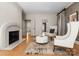 Bright living room features wood floors, stone fireplace, and modern furnishings at 4429 Cameron Oaks Dr, Charlotte, NC 28211