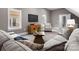 Comfortable living room with large TV and comfortable seating at 4429 Cameron Oaks Dr, Charlotte, NC 28211