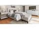 Bright bedroom with white furniture, gray throw blanket and beige carpet at 4429 Cameron Oaks Dr, Charlotte, NC 28211
