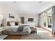 Serene main bedroom with hardwood floors, French doors, neutral decor, and a relaxing atmosphere at 4429 Cameron Oaks Dr, Charlotte, NC 28211