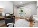 Inviting home office with natural light, neutral color palette, hardwood floors, and classic furnishings at 4429 Cameron Oaks Dr, Charlotte, NC 28211