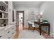 Stylish home office with hardwood floors, neutral colors, ample storage, and a comfortable workspace at 4429 Cameron Oaks Dr, Charlotte, NC 28211