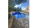 Inviting backyard pool with stone surround and decorative flamingo, a peaceful oasis at 504 Johnsfield Rd, Shelby, NC 28150