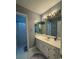 Cozy bathroom with white vanity, decorative lighting, and tiled shower area at 504 Johnsfield Rd, Shelby, NC 28150