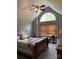 Tranquil bedroom featuring a vaulted ceiling, large window, and a classic wooden bed frame at 504 Johnsfield Rd, Shelby, NC 28150