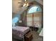 Charming bedroom features a large arched window, light gray walls, and playful flamingo decor at 504 Johnsfield Rd, Shelby, NC 28150