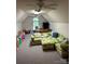Large bonus room with vaulted ceilings, striped wallpaper, a cozy couch, and ample play space at 504 Johnsfield Rd, Shelby, NC 28150