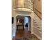 Inviting foyer with hardwood floors, staircase, and view into the living room, bathed in natural light at 504 Johnsfield Rd, Shelby, NC 28150