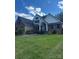Beautiful two-story brick home with a well-manicured lawn and traditional architectural details at 504 Johnsfield Rd, Shelby, NC 28150