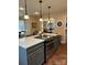 Modern kitchen with stainless steel appliances, granite countertops, and an open view to the breakfast nook at 504 Johnsfield Rd, Shelby, NC 28150