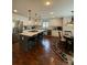 Bright kitchen features stainless steel appliances, large center island with seating and stylish pendant lighting at 504 Johnsfield Rd, Shelby, NC 28150