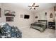 Comfortable bedroom with neutral walls, a ceiling fan, and space for relaxation at 5252 Ramblewoods Ave, Claremont, NC 28610