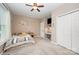 Comfortable bedroom featuring a ceiling fan, closet, decor, and neutral carpet at 5252 Ramblewoods Ave, Claremont, NC 28610