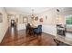 Elegant dining room with hardwood floors, chair rail, and view of the open concept floorplan at 5252 Ramblewoods Ave, Claremont, NC 28610