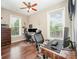 Well-lit office space with hardwood floors, and large windows, creating a productive and inviting workspace at 5252 Ramblewoods Ave, Claremont, NC 28610