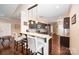 Modern kitchen with granite countertops, stainless steel appliances, and bar seating at 5252 Ramblewoods Ave, Claremont, NC 28610
