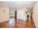 Spacious living room with rich hardwood floors and views of the backyard pool and outdoor space at 5252 Ramblewoods Ave, Claremont, NC 28610