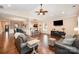 Open-concept living area showcases hardwood floors, vaulted ceilings, and seamlessly integrates kitchen and dining at 5252 Ramblewoods Ave, Claremont, NC 28610