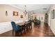 Bright, open-concept living and dining area with hardwood floors and access to the outdoor space at 5252 Ramblewoods Ave, Claremont, NC 28610