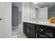 Neutral bathroom featuring a white vanity top, dark wood cabinetry, and access to a shower at 5718 Bardsey Ct, Matthews, NC 28104