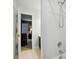 Bathroom featuring white tiled walk-in shower and doorway to another bedroom at 5718 Bardsey Ct, Matthews, NC 28104