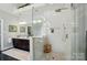 Bathroom featuring a glass walk-in shower, dual sink vanity, and modern fixtures, creating a spa-like experience at 5718 Bardsey Ct, Matthews, NC 28104