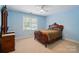 Classic bedroom with a decorative wooden bed frame, bright blue walls, and a dresser, offering a comfortable and stylish retreat at 5718 Bardsey Ct, Matthews, NC 28104