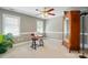 Spacious bedroom with a sewing machine, lots of light and a large wardrobe providing a creative and functional space at 5718 Bardsey Ct, Matthews, NC 28104