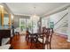 Elegant dining room featuring hardwood floors, chandelier, and staircase at 5718 Bardsey Ct, Matthews, NC 28104