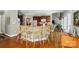 Expansive kitchen featuring a wraparound bar with seating, stainless appliances, and wood cabinets at 5718 Bardsey Ct, Matthews, NC 28104