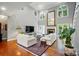 Bright and airy living room with tall ceilings, fireplace, and large windows providing natural light at 5718 Bardsey Ct, Matthews, NC 28104
