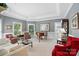 Elegant living room with tray ceilings, large windows, and classic furnishings at 5718 Bardsey Ct, Matthews, NC 28104