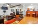 Open basement features wooden floors, an open floor plan, and an entertainment space with a bar at 6221 Thermal Rd, Charlotte, NC 28211