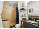 Well-maintained bathroom featuring a tiled shower, vanity, and decorative mirror at 6221 Thermal Rd, Charlotte, NC 28211