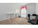 Bright bedroom features neutral walls, large windows with an ample amount of space for working or relaxing at 6221 Thermal Rd, Charlotte, NC 28211