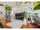 Cozy fireplace with decorative mantel, hardwood floors and accent rug at 6221 Thermal Rd, Charlotte, NC 28211
