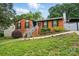 Charming brick home with a well-manicured lawn and inviting stairway entrance at 6221 Thermal Rd, Charlotte, NC 28211