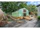 View of greenhouse with ramp and garden bed featuring landscaping rocks at 6221 Thermal Rd, Charlotte, NC 28211