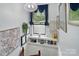 Hallway that features a lot of natural light with art and decor for aesthetic at 6221 Thermal Rd, Charlotte, NC 28211